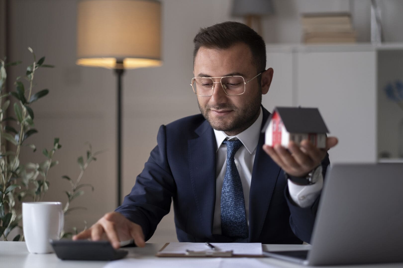 Real estate professional working with laptop