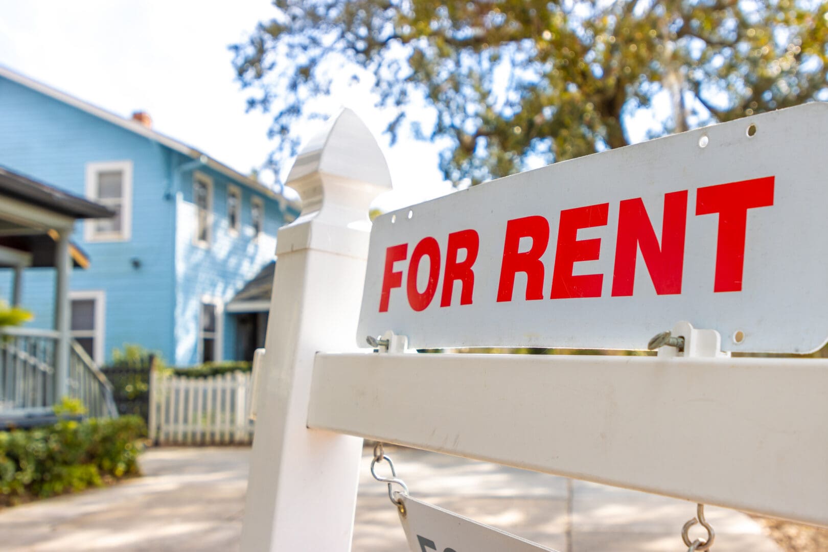 Real estate rental sign and building