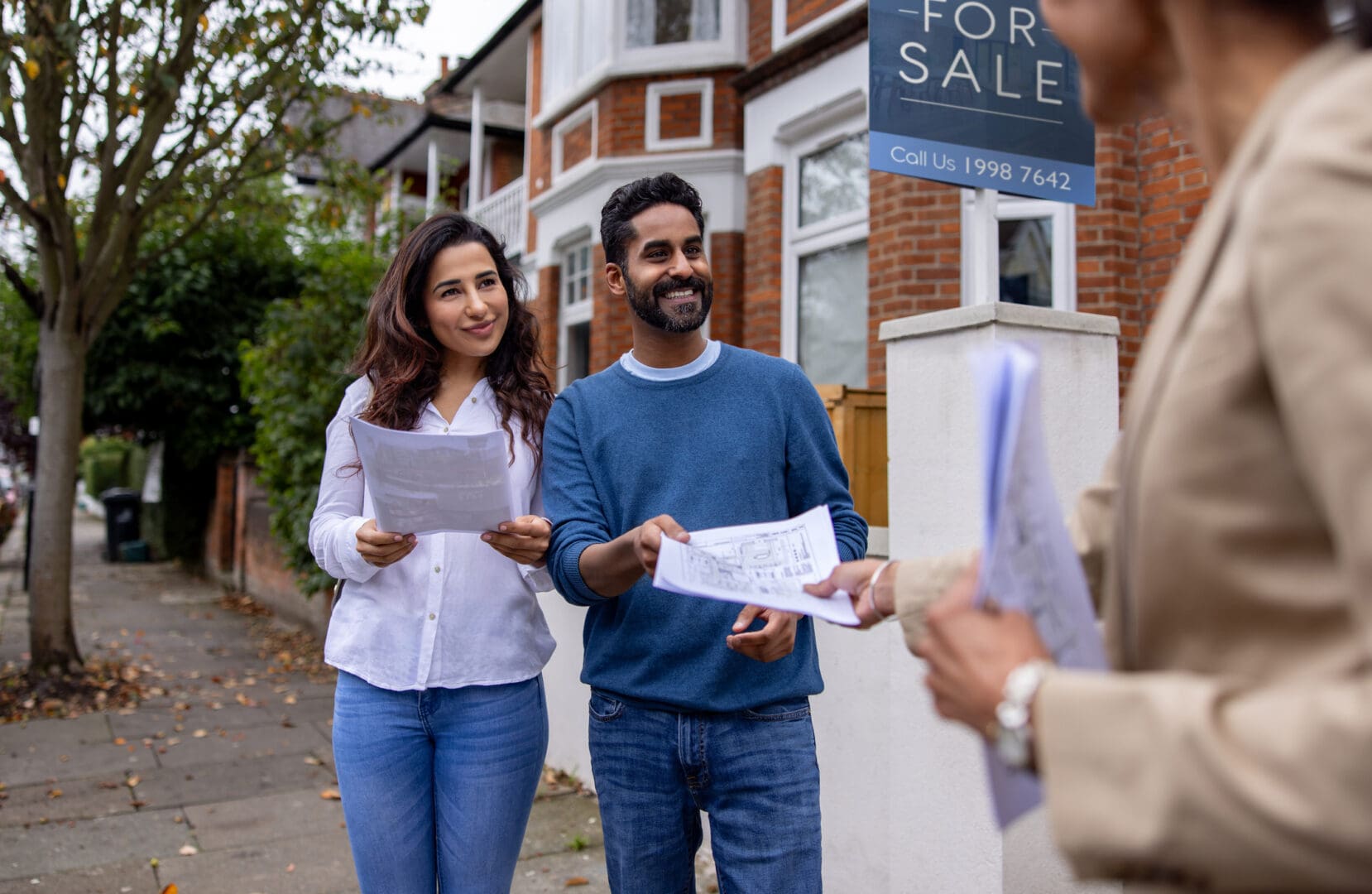 House buyers with real estate agent