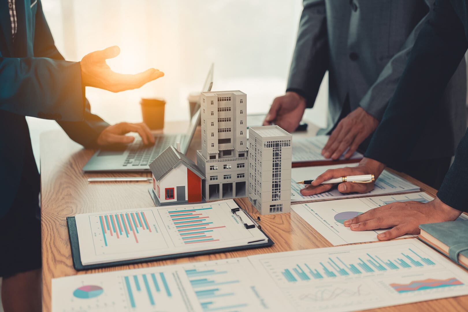 Professionals analyzing real estate data together