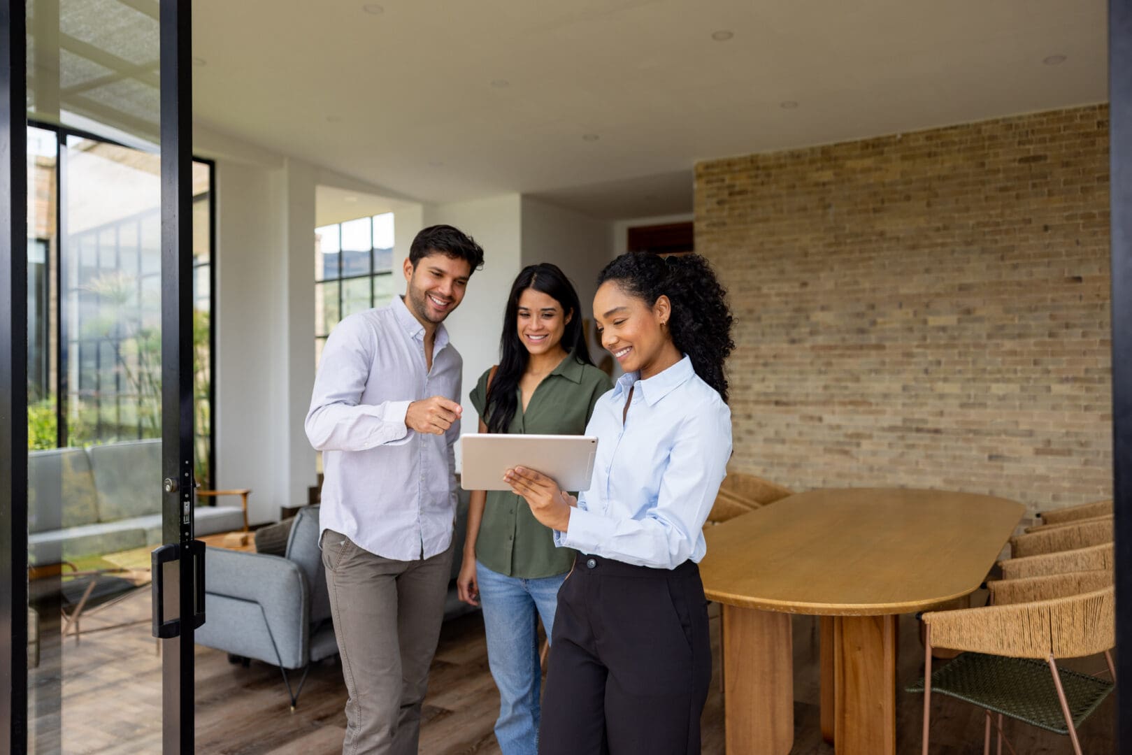People touring house with a real estate agent