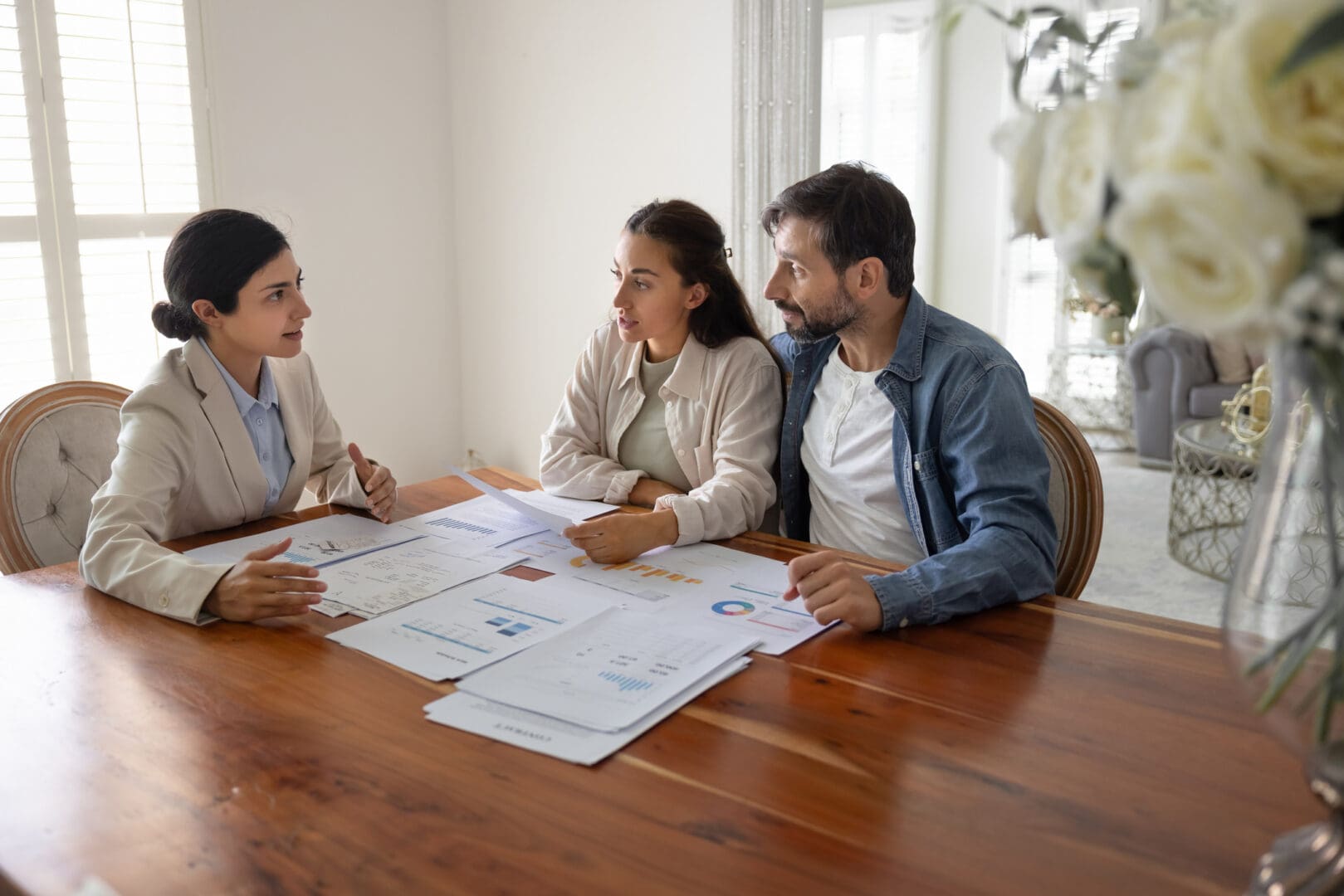 Professionals discussing financial documents together