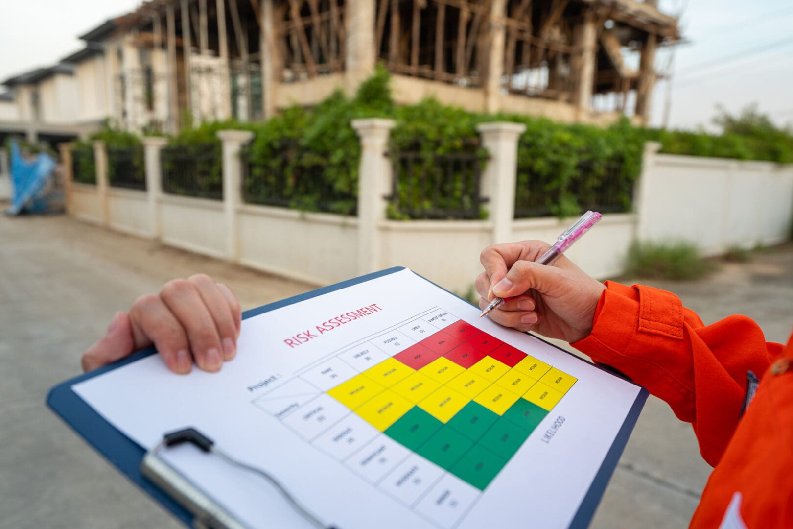 Worker completing risk assessment form