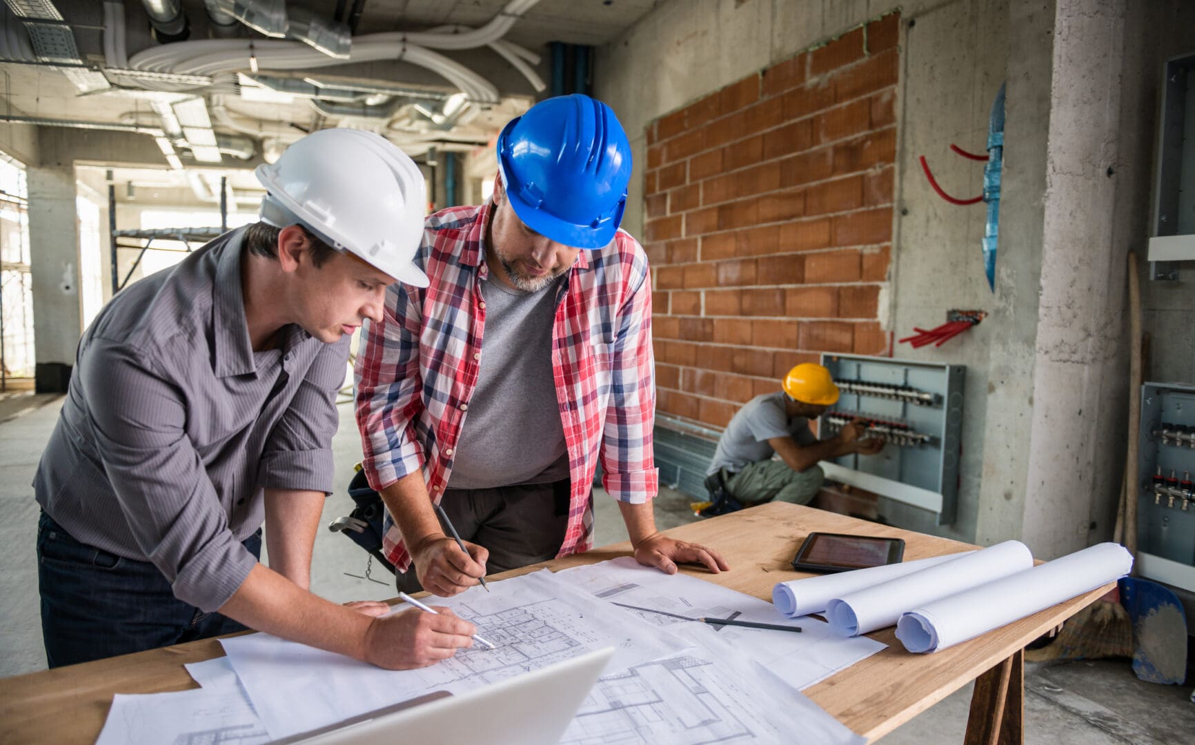 Team planning construction project indoors