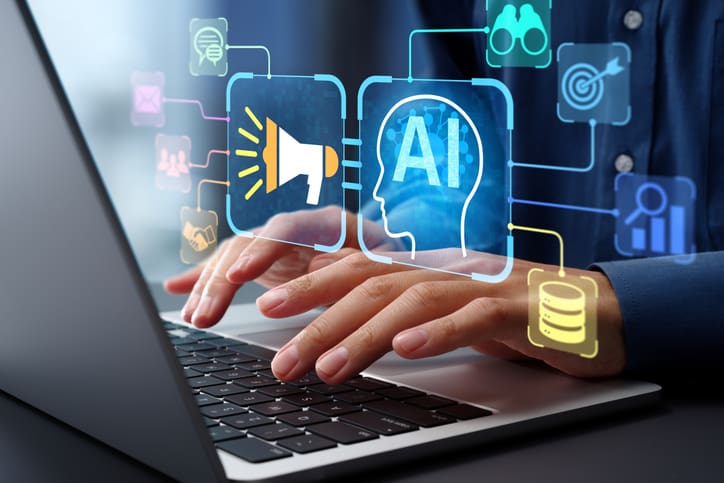 Hands typing on a laptop with AI and technology icons floating above.