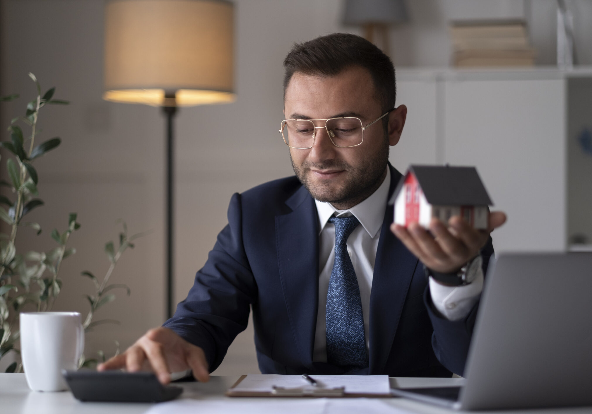 Real estate professional working with laptop