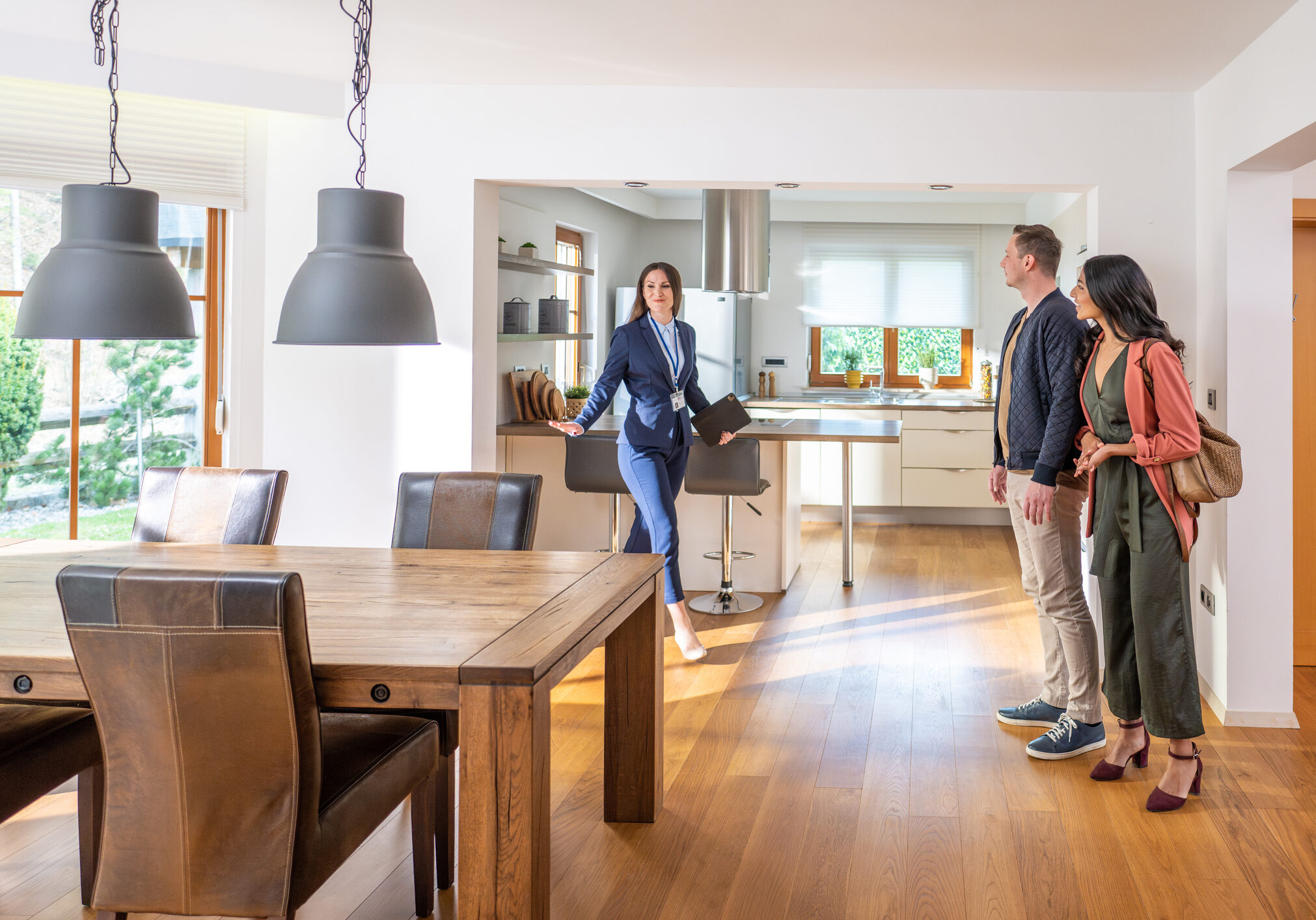 Real estate agent showing modern kitchen