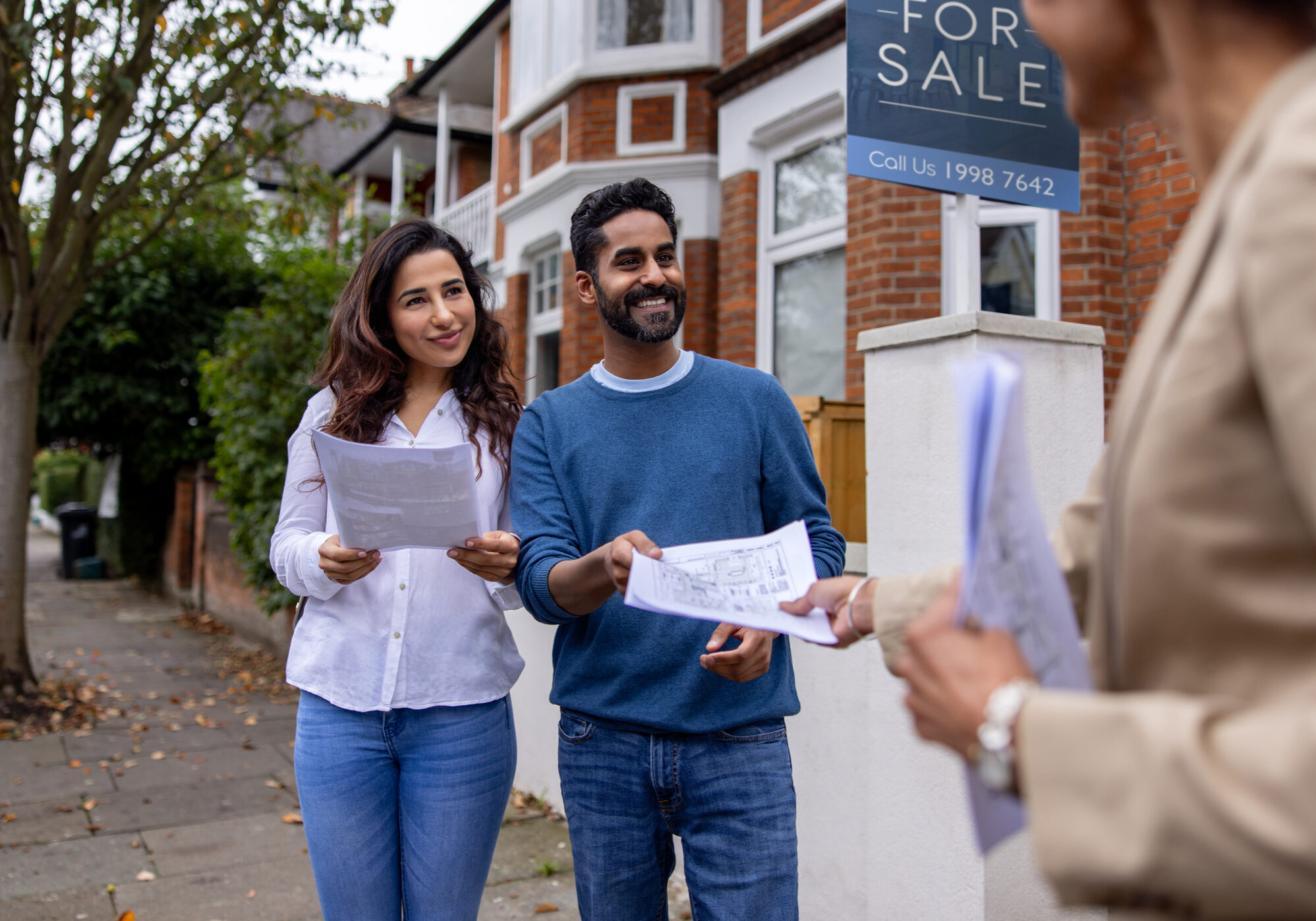 House buyers with real estate agent