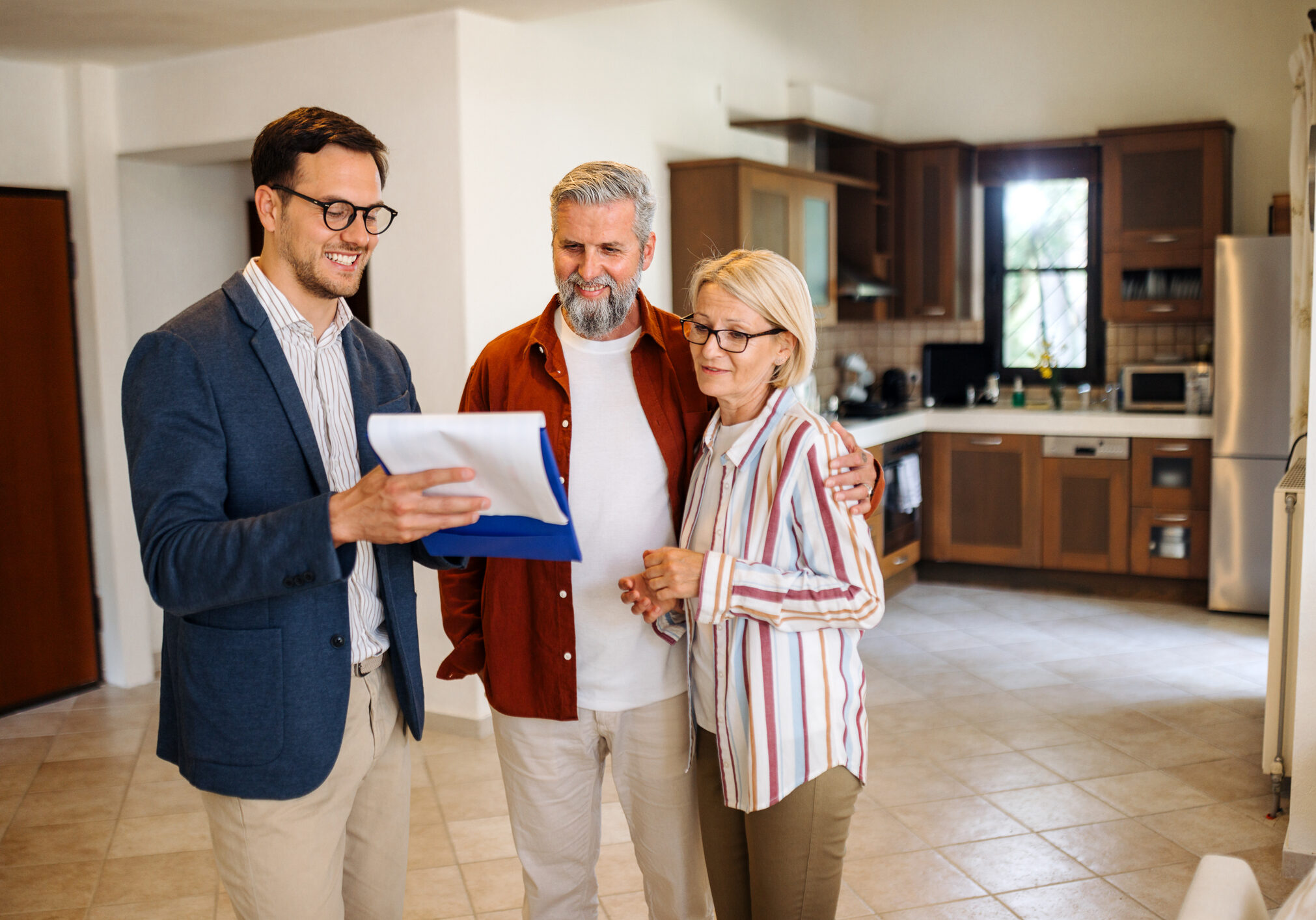 Couple reviewing documents with agent