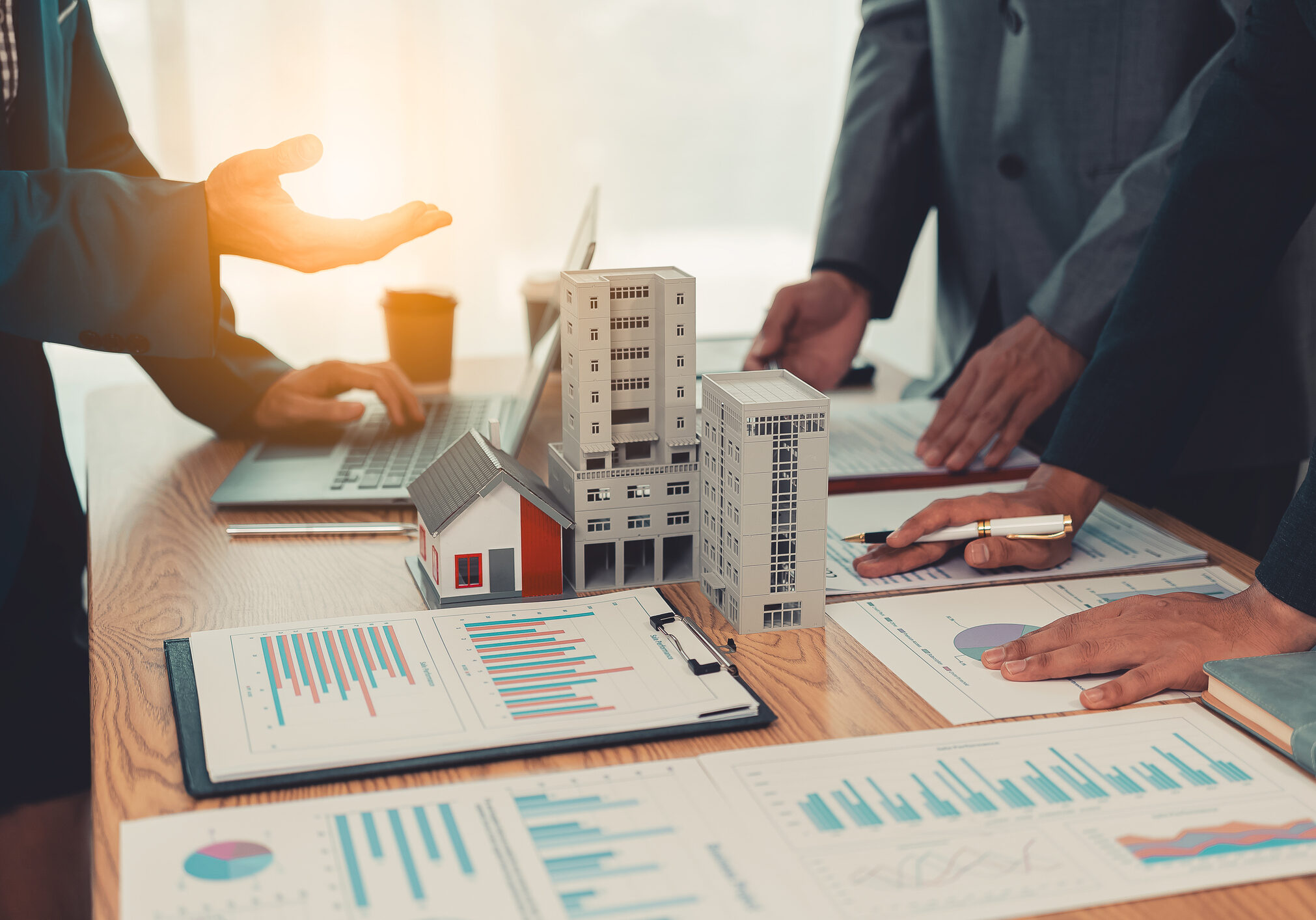 Professionals analyzing real estate data together
