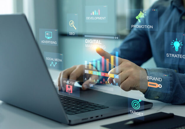 Businessman analyzing digital data charts on laptop screen.
