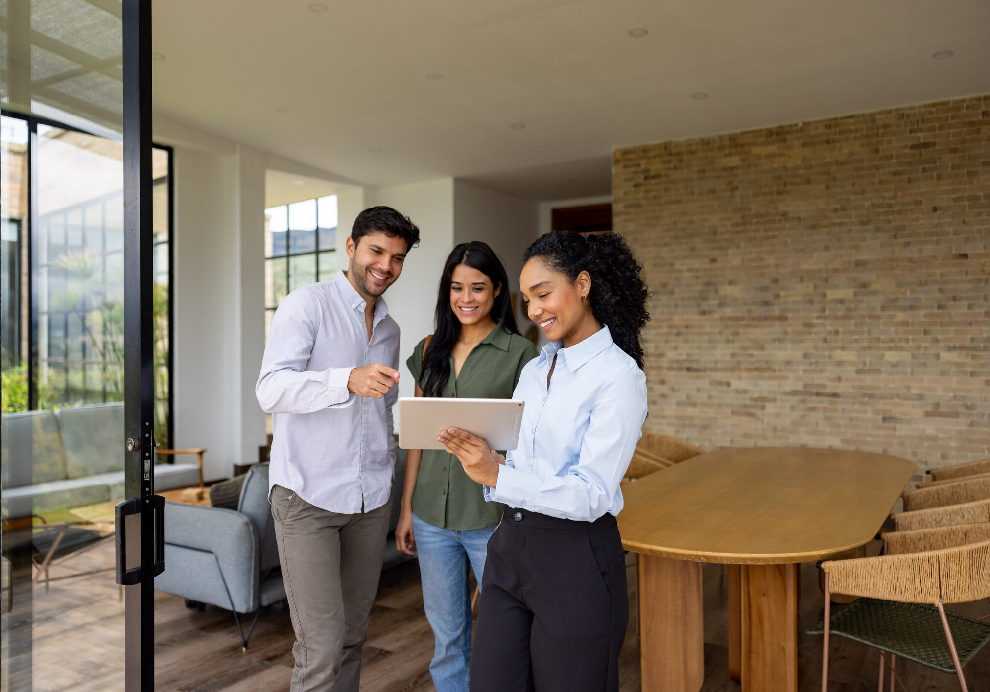 People touring house with a real estate agent