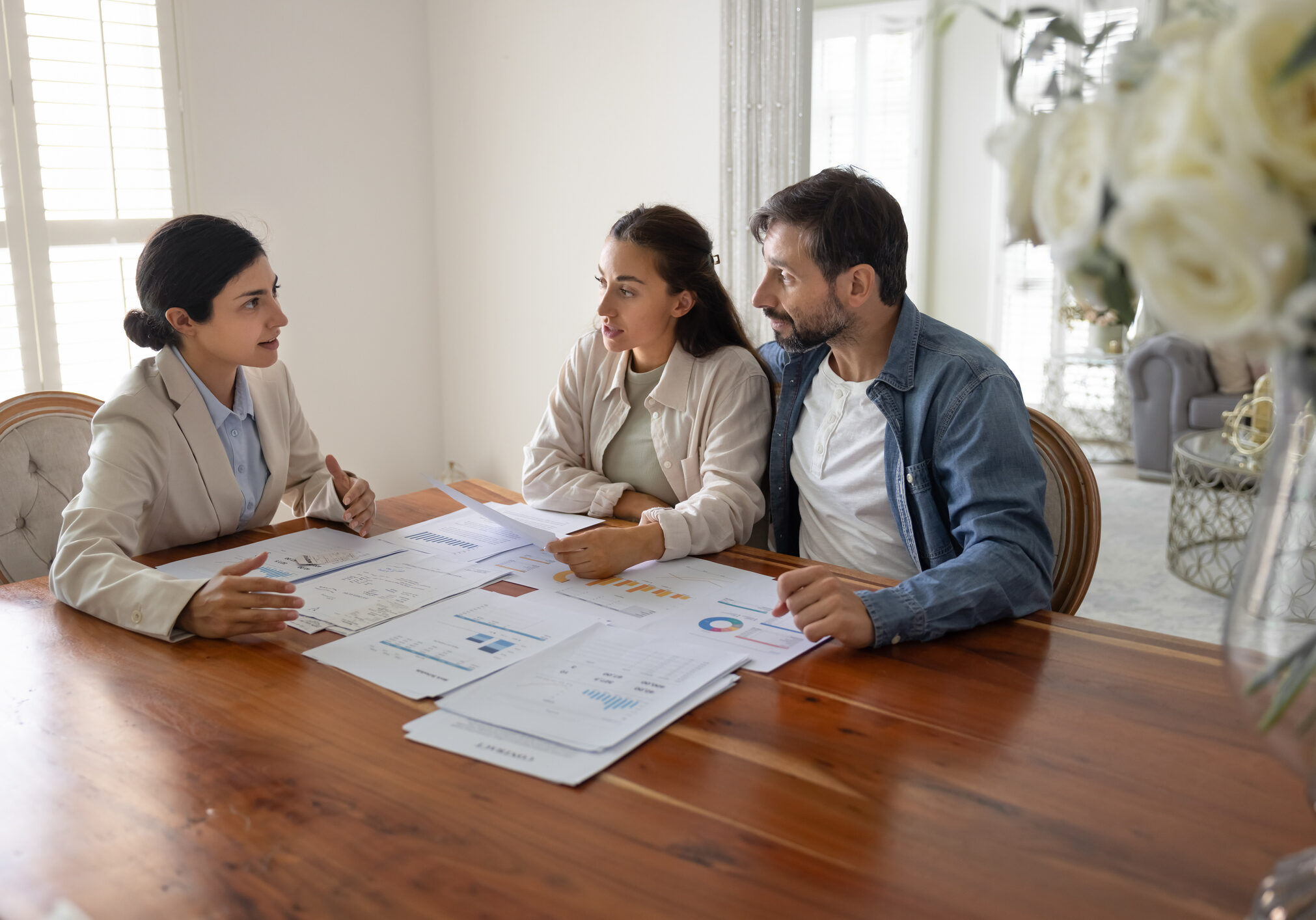 Professionals discussing financial documents together