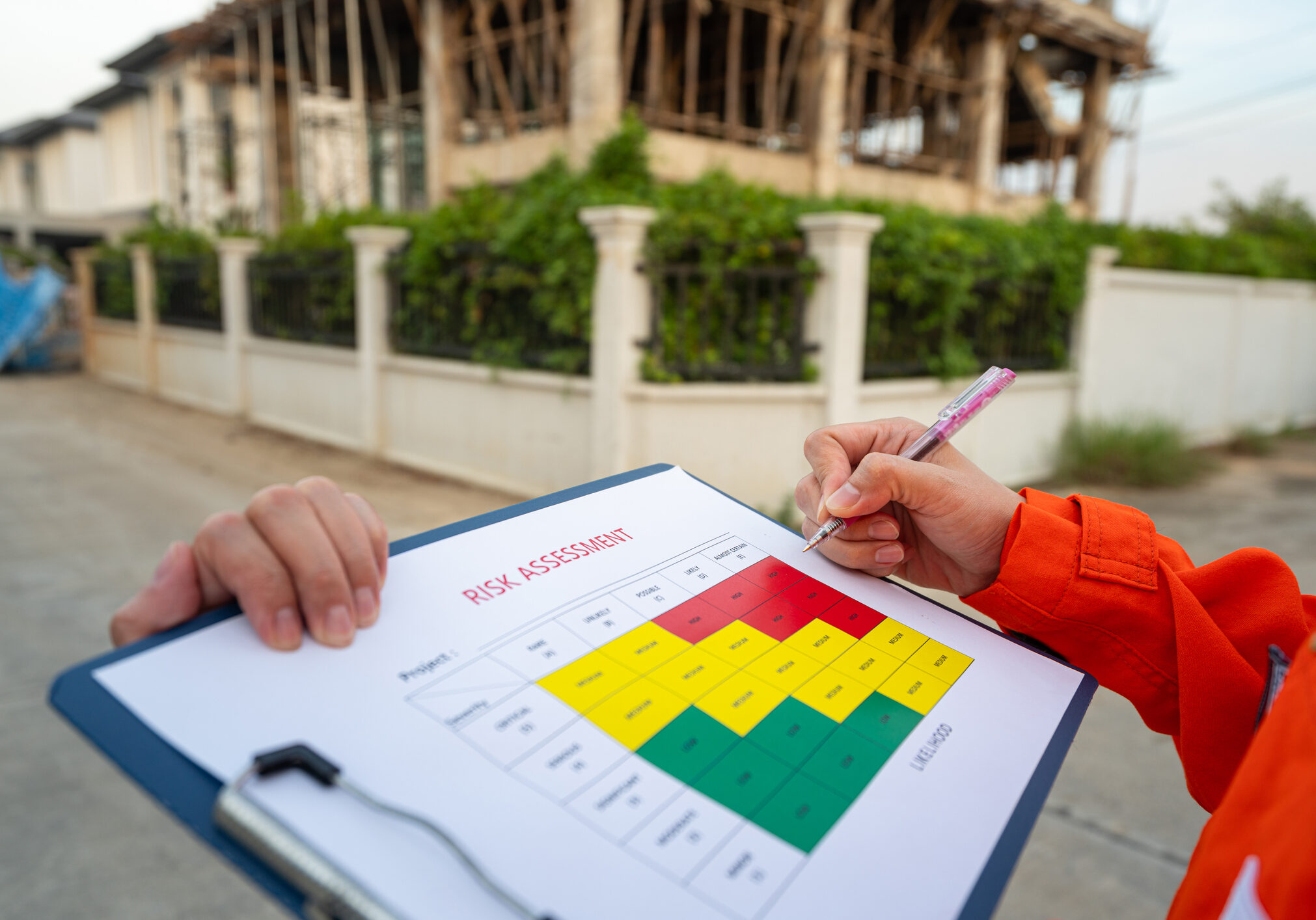 Worker completing risk assessment form