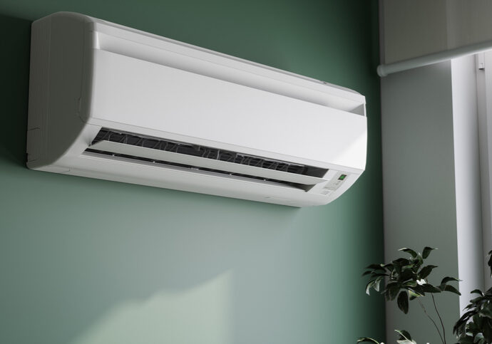 Modern wall-mounted air conditioner installed in a room.