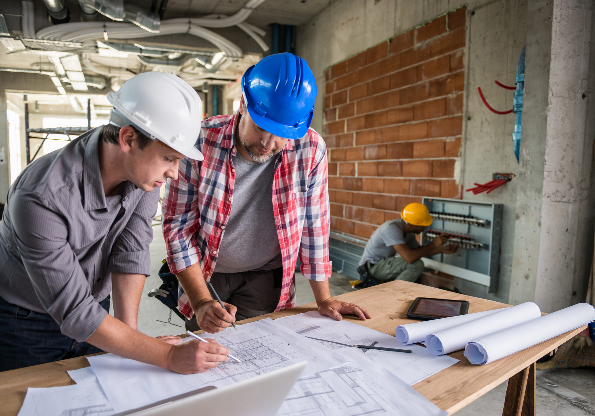 Team planning construction project indoors