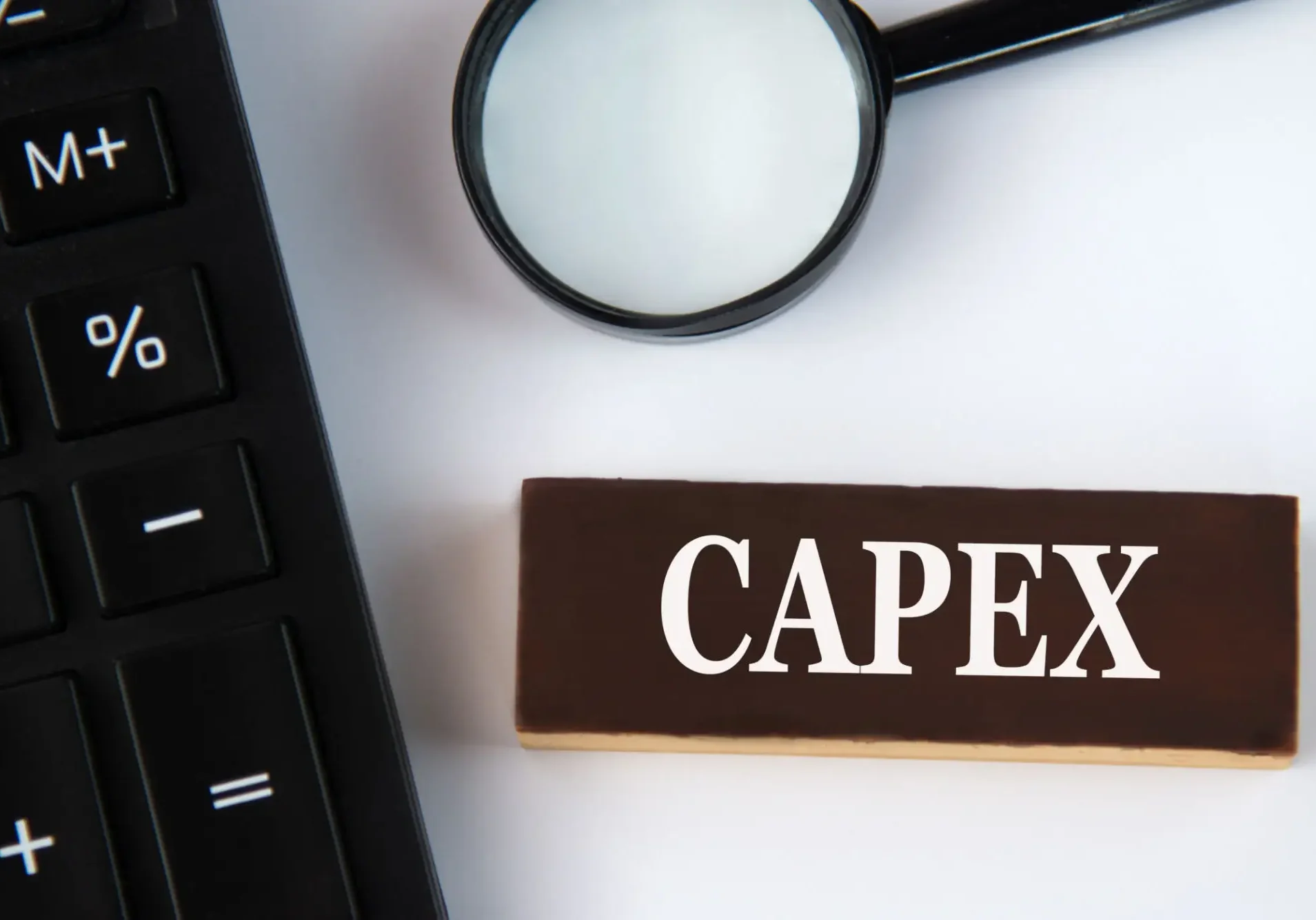 Calculator, magnifying glass, CAPEX booklet