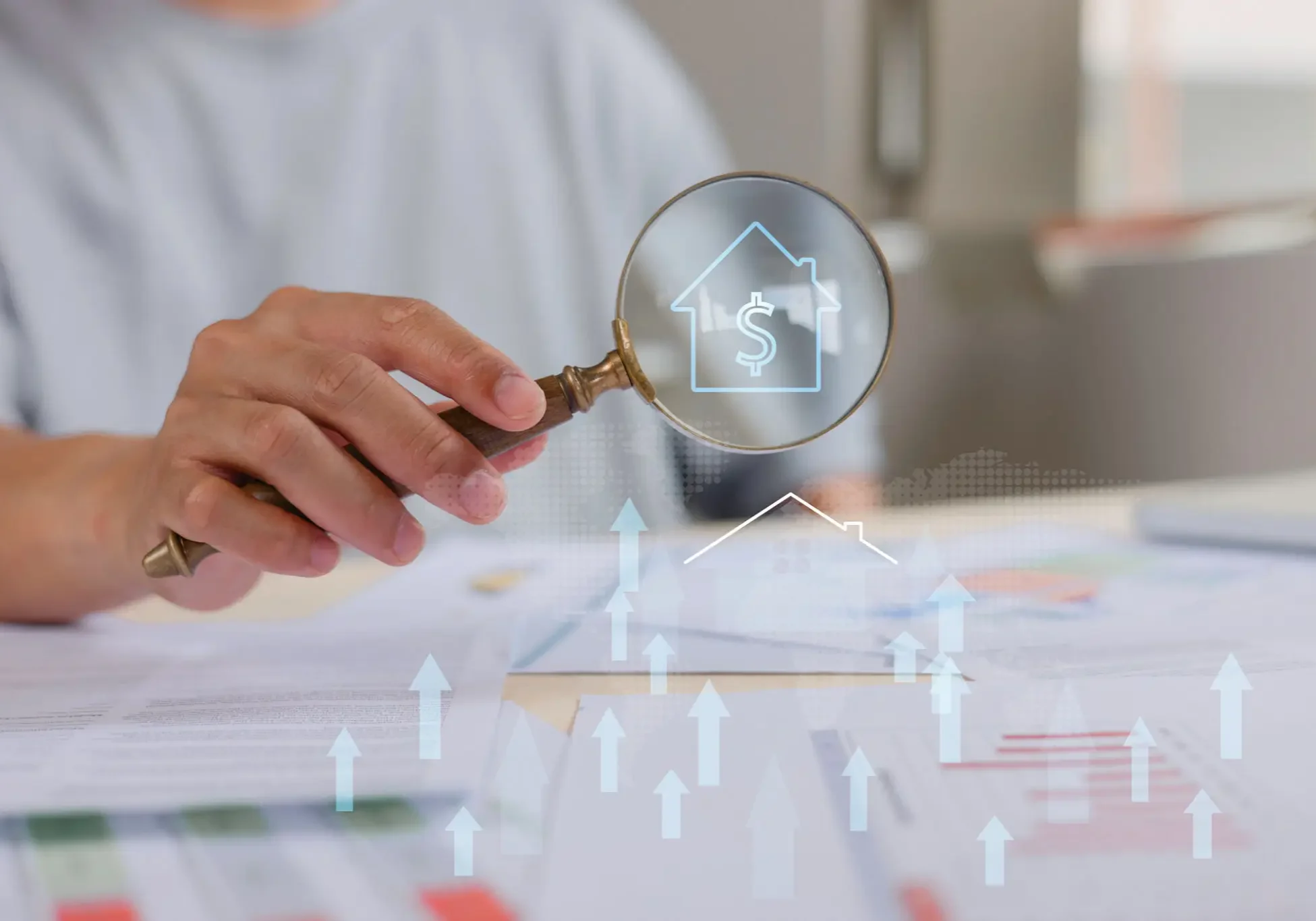 Magnifying glass over house dollar icon