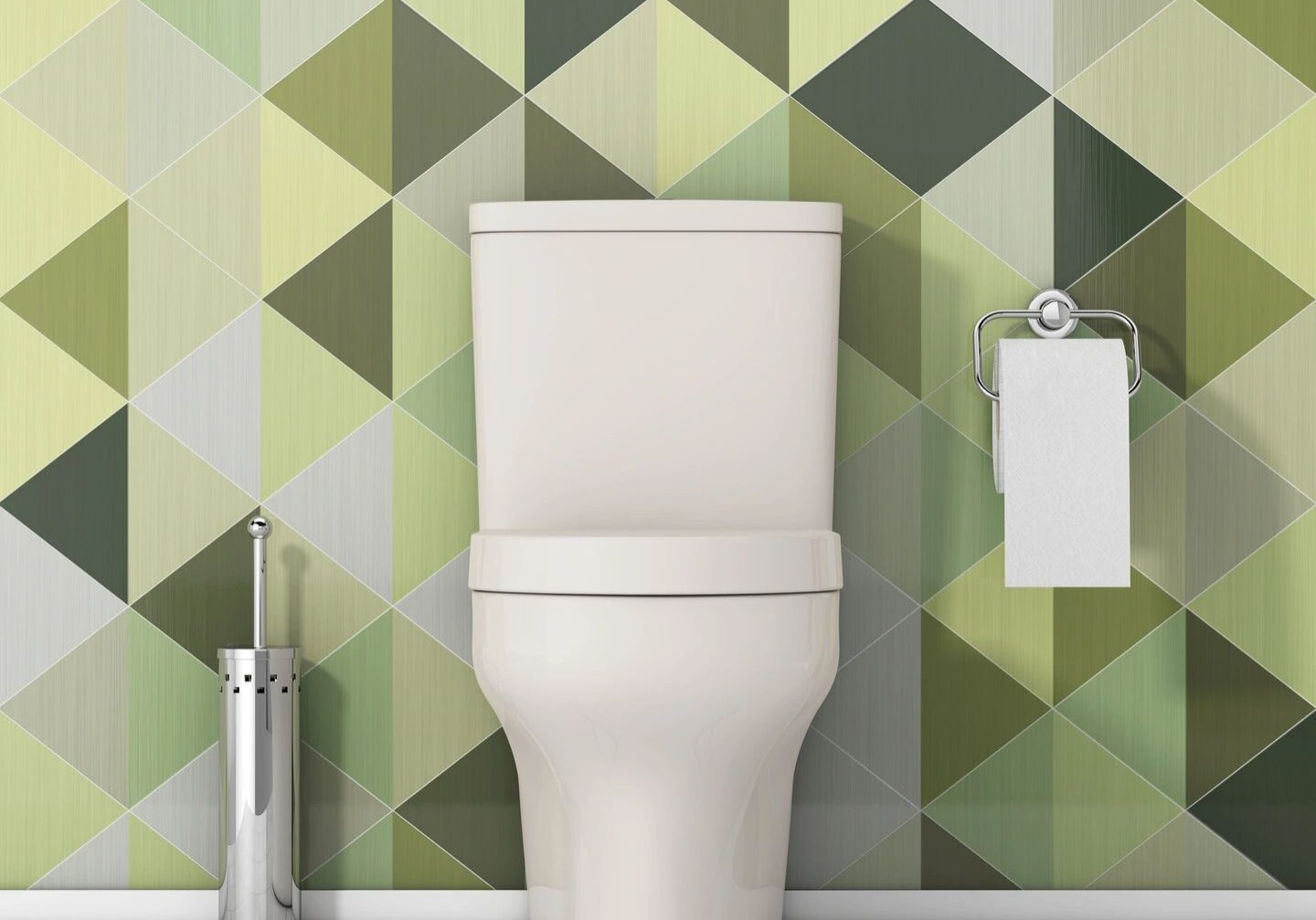 Modern toilet with geometric patterned wall tiles in green tones.